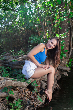 Sumiko nude photo 02 - Sumiko Strips Outdoors On The Tree Roots By A Creek