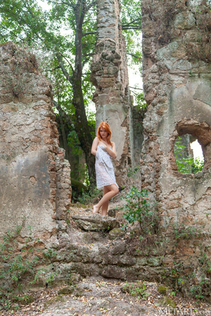 Mia Sollis Sits Spread-Legged Against Lichen-Covered Rock - Photo 00