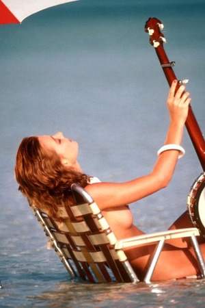 Janet Sharpe Kneels Wet On A Yellow Pool Float - Photo 06
