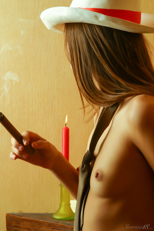 Hebe Cigar And Cowboy Hat By The Fireplace - Photo 05